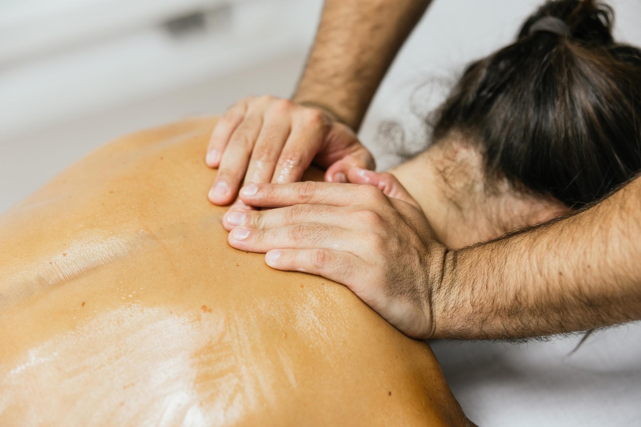 Deep tissue massage pressure work for back pain in Dubai